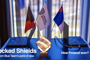 Flags and computers on a desk and headline: Locked Shields